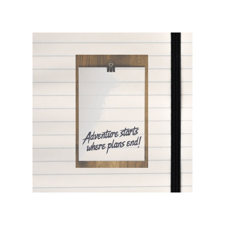 A clipped paper on wood declares “Adventure starts where plans end!” in bold, spontaneous style.