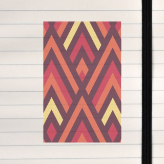 This design is a bold geometric pattern built from repeating triangles and diamond shapes in warm, glowing colors that create a