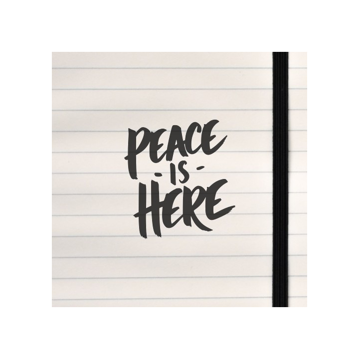 Bold brushstroke lettering declares “PEACE IS HERE” in a minimalist black-on-white design, radiating calm and presence.