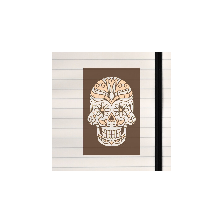 A monochrome sugar skull decorated with floral and ornamental patterns in warm beige tones on a dark background.