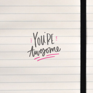 A playful hand‑lettered “You’re awesome” design with bold black lettering and soft pink accents.