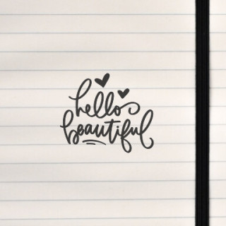 A warm, handwritten message accented with hearts and a gentle decorative flourish.