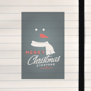 A clean, modern Christmas design featuring a minimalist snowman face and festive lettering.