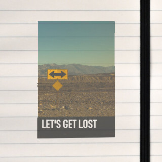 A playful desert‑road sign inviting adventure and open‑ended wandering.