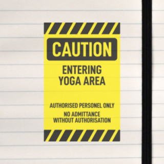 A bold warning sign marking a restricted yoga practice area.