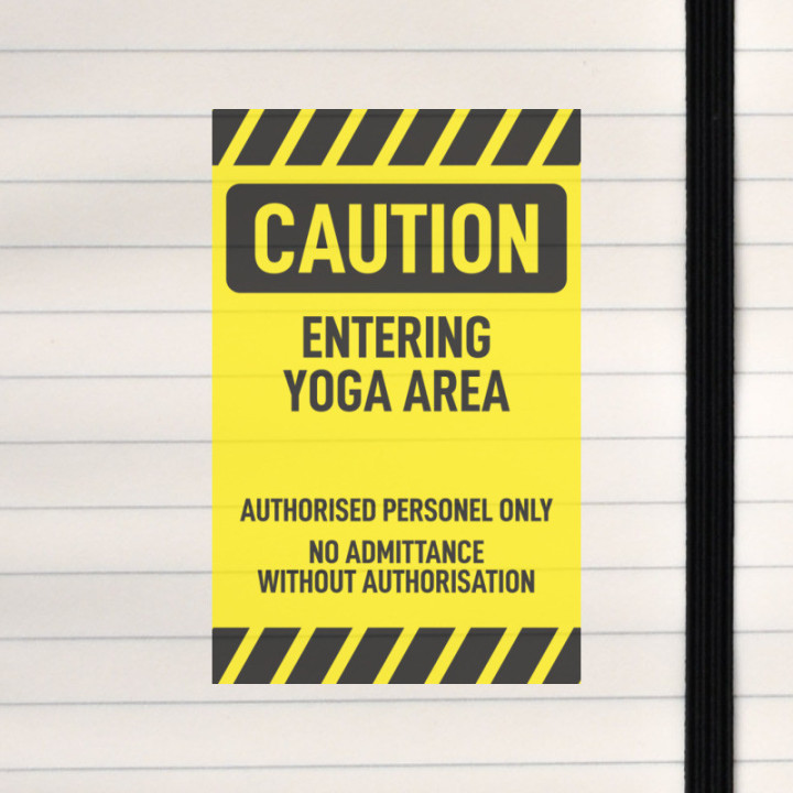 A bold warning sign marking a restricted yoga practice area.