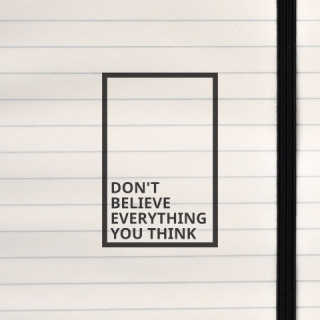 A minimalist black-and-white design featuring a bold, thought-provoking message framed in a clean rectangular border.