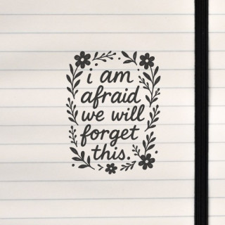 A delicate black‑and‑white floral frame surrounds a handwritten phrase creating a quiet, nostalgic mood.