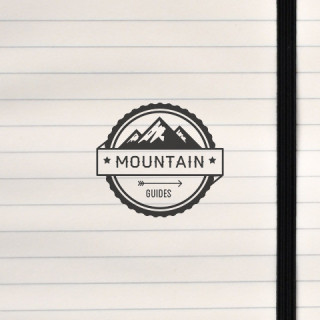 A circular badge for Mountain Guides.