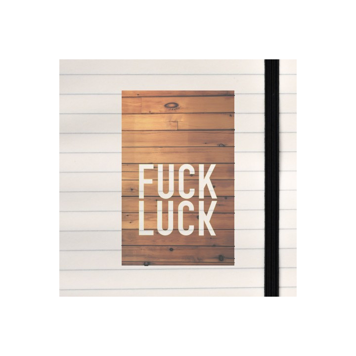 Fuck luck on a wooden background.